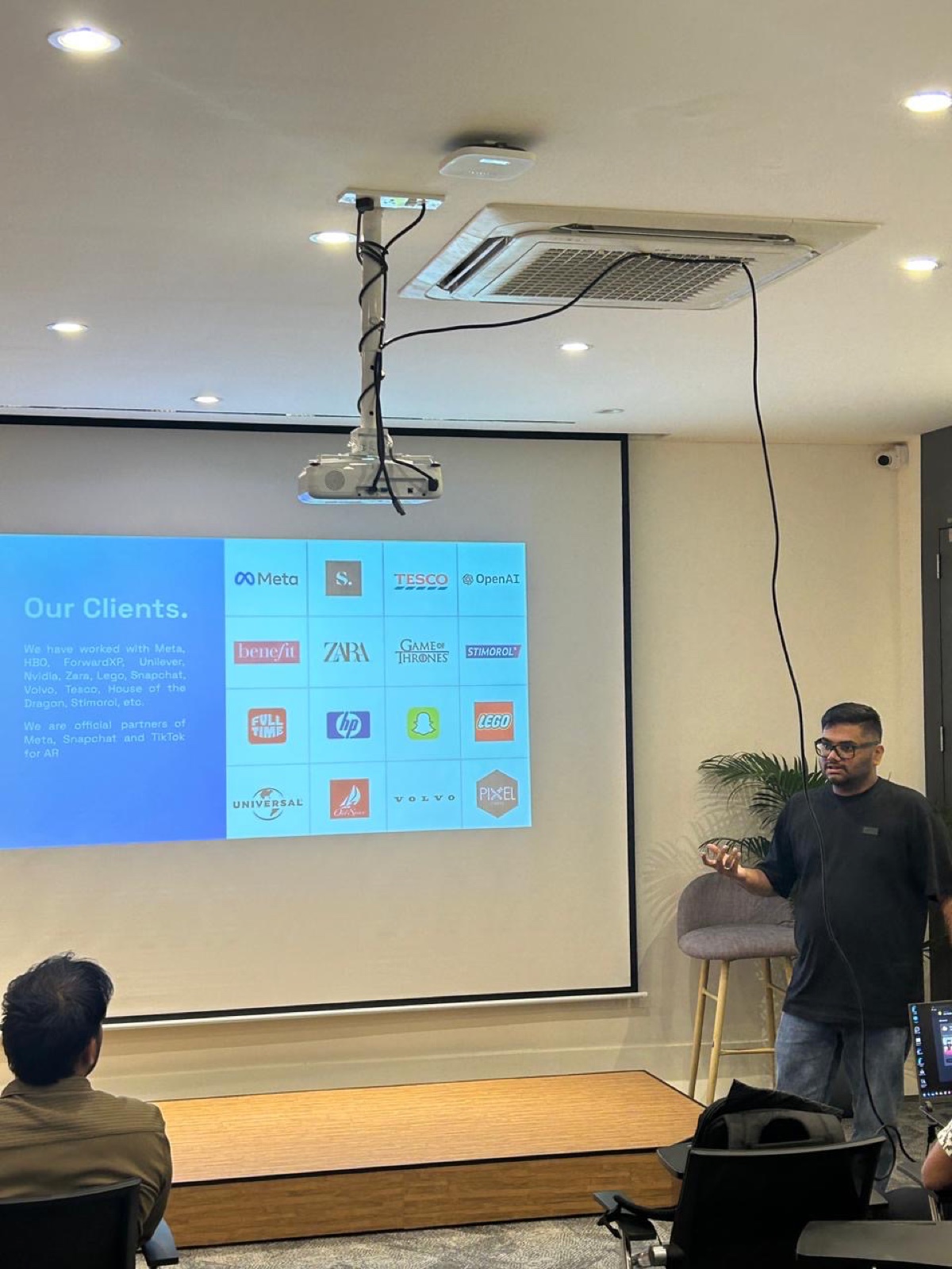 Kavin presenting client portfolio at a Bangalore studio session