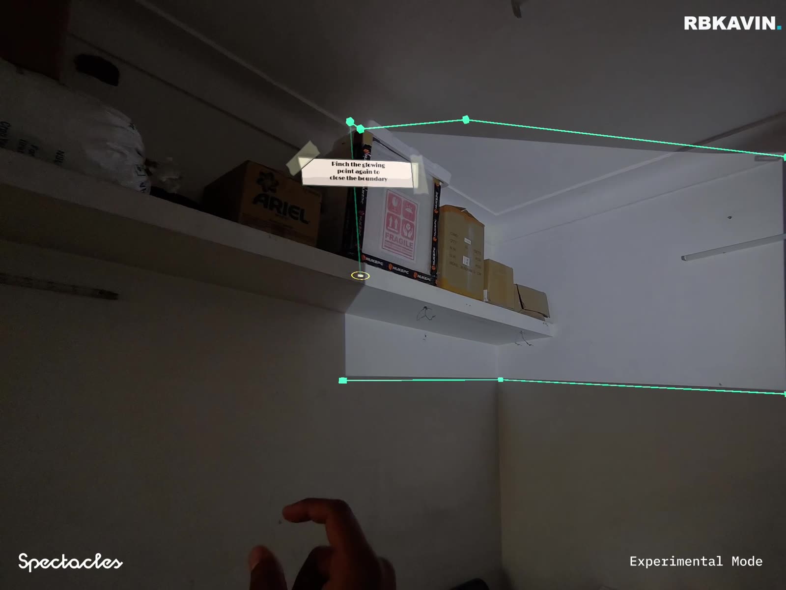 Spatial Mapper tool on Snap Spectacles tracing a green boundary line along the real corners of a room to build a spatial map.